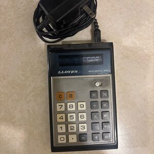 Lloyd's Accumatic 310 Calculator - Black and Gray